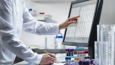researcher performing clinical trial