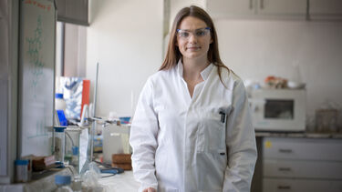 Chemistry PhD student in lab coat