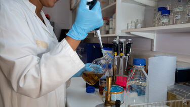A female student working with equipment in the reproductive medicine lab.