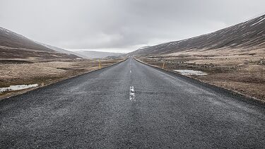 A photograph of a road disappearing into the horizon to symbolise long-term planning.