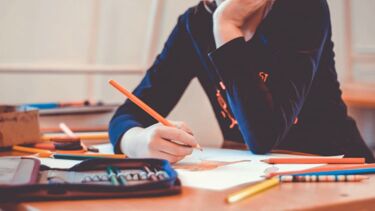 Person drawing in a classroom