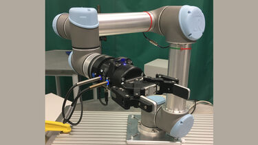Universal Robots UR5 robot equipped with a Robotiq 2-finger gripper, wrist camera, force torque sensor, and Alumotion YOUring