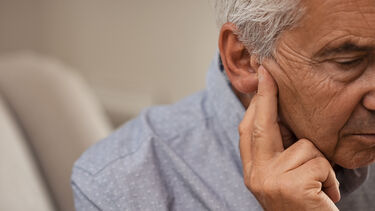 Senior man with hearing loss