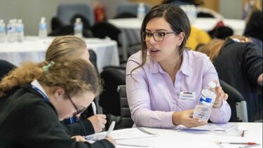 Dounia Bakira, Applications Engineer at AESSEAL, speaking to two girls