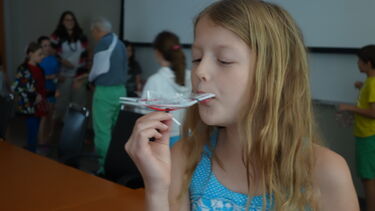 Child taking part in the Buckyball workshop