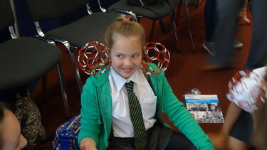Child taking part in the Buckyball workshop