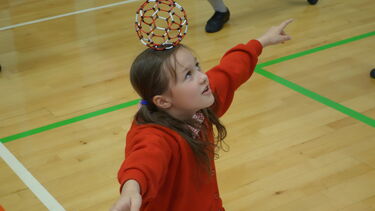 Child taking part in the Buckyball workshop