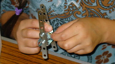 Child taking part in the Buckyball workshop