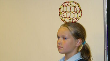 Child taking part in the Buckyball workshop