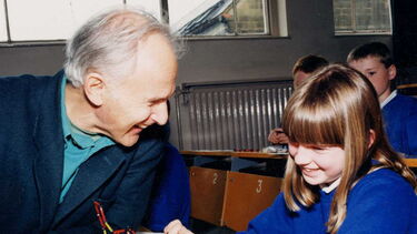 Harry Kroto with a child taking part in a Buckyball workshop.