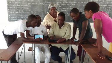 Lupane community team editing their video together