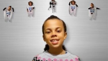 Child in front of grey background