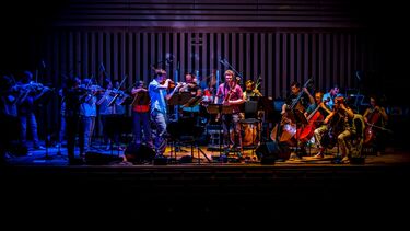 Manchester Camerata playing instruments on stage