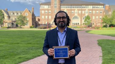 Jaime Delgadillo holding SPR award