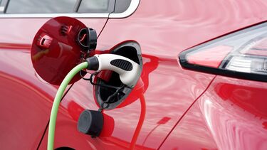 Image of a red electric car charging