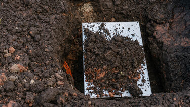 FOSS The Wave Time Capsule - dirt on steel capsule