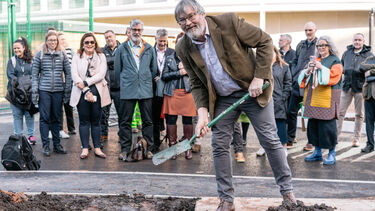 FOSS The Wave Time capsule professor craig watkins throwing dirt