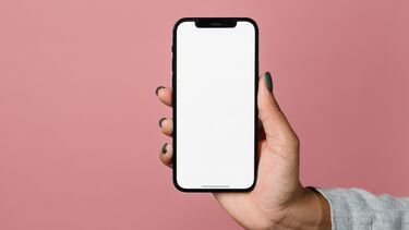 Image of hand holding a smartphone using natural language processing
