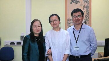 SCI Interim Director, Professor Li Xiao stands with Teacher Li Jia and SCI Deputy Director, Dr Zhang Daojian