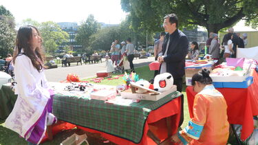 Teacher Lina and SCI Deputy Director, Dr Zhang at the shopping stall