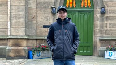 Photograph of Himanshu on the University of Sheffield Campus outside St George's Church
