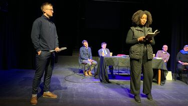 Author reading on a stage
