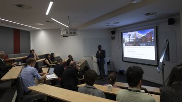 Academics and researchers sat in a lecture theatre.