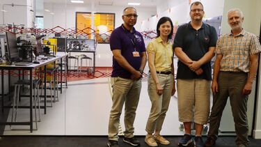 ASISST project group standing next to teaching clean room at the University of Sheffield