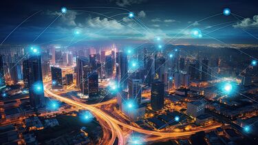 Stock image of city with graphics representing the transfer of data