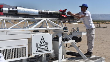 Photo of Merlin Reeves-Dyer (Technical Lead at Sunride) installing the igniter into Karman Alpha’s lower stage