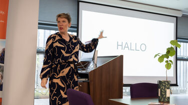 Paulien Cornelisse at a lectern 