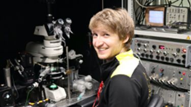 samual webb in front of equipment