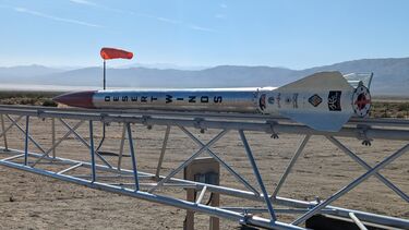 The liquid-fuelled rocket built by University of Sheffield students lying on its side ready to be moved into position for launch in the US desert