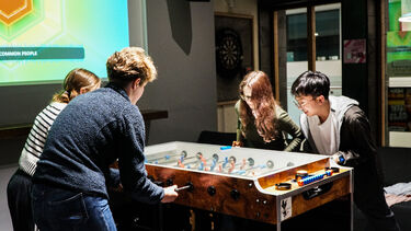 Students play table football at Edge Bar Endcliffe 
