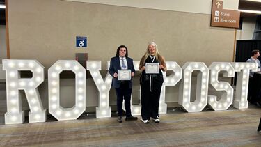 Luke and Ava holding certificates