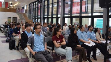 Conference attendees listening to a presentation 
