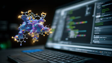 A floating atomic structure in front of a computer screen displaying digital code