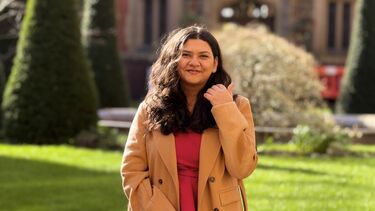 Harshada is standing in front of a building at the University of Sheffield