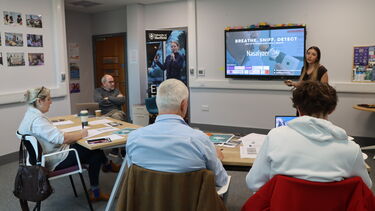 Picture of student pitching business idea to panel