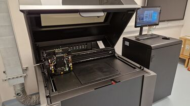 3D lab machinery with a computer screen in the background