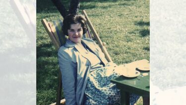 A young woman laying back in a sunchair