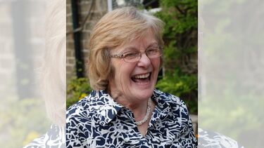 A smiling lady with glasses