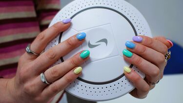 Ciara holding an air quality detector