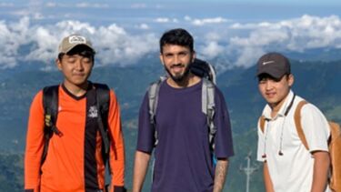 3 men on travels through Nepal in hiking clothing