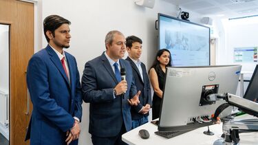 a group of 4 MBA students presenting