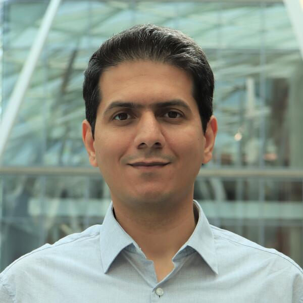 Profile picture of A man in a light blue shirt smiles at the camera