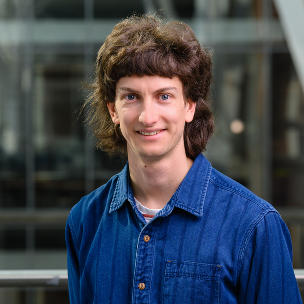 Profile picture of Male with brown hair in denim blue shirt