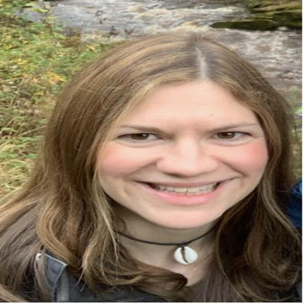Profile picture of Siobhan Taylor smiling outside with a river in the background