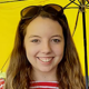 A profile photo of Jessica Williams with an umbrella.