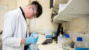 A medical student using lab equipment
